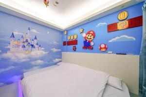 Ein Bett oder Betten in einem Zimmer der Unterkunft Jinduo Family Homestay