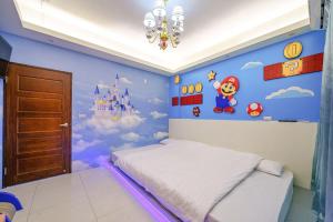 Ein Bett oder Betten in einem Zimmer der Unterkunft Jinduo Family Homestay