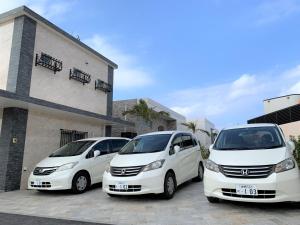 three white cars parked in front of a building at -Villa Rikyu- 離宮 in Miyako-jima +18 photos