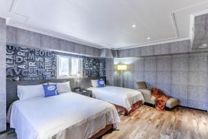 Postel nebo postele na pokoji v ubytování CU Hotel Kaohsiung