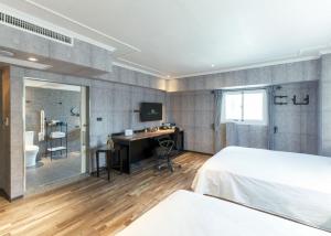 Postel nebo postele na pokoji v ubytování CU Hotel Kaohsiung