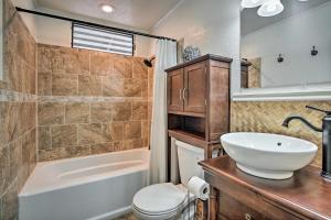 a bathroom with a sink and a toilet and a tub at Hilltop Home with Ocean View in Kailua-Kona! in Kailua-Kona +20 photos