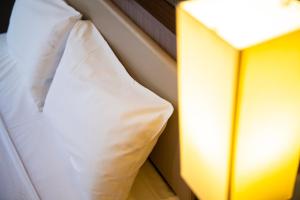 Postel nebo postele na pokoji v ubytování KOKO HOTEL Ginza-1chome