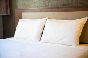 Postel nebo postele na pokoji v ubytování KOKO HOTEL Ginza-1chome