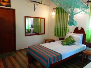 Postel nebo postele na pokoji v ubytování Hideaway Homestay Habarana
