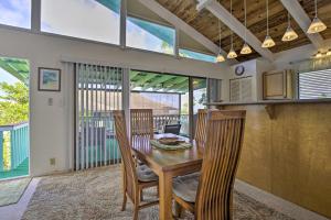 a dining room with a wooden table and chairs at Kona Highlands Family Getaway 10-15 Min to Town! in Kailua-Kona +17 photos