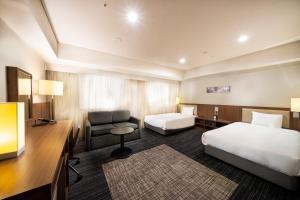 Postel nebo postele na pokoji v ubytování KOKO HOTEL Ginza-1chome