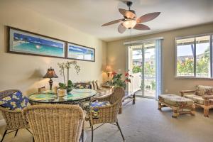 a living room with a table and chairs and a ceiling fan at Hawaiian Hideaway Pool Access, 1 Mi to Beach in Kapolei