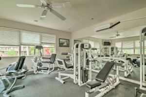 a gym with several treadmills and exercise bikes at Luxe Big Island Vacation Rental Along Kohala Coast in Waikoloa