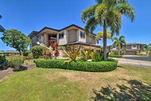 a house with a palm tree in front of a yard at Tropical Paradise Resort Villa 1 Mile to Beach! in Waikoloa