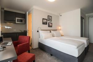 Ένα ή περισσότερα κρεβάτια σε δωμάτιο στο The Stay.residence