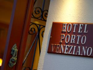 a sign that reads hotel portal vancouver on a wall at Porto Veneziano Hotel in Chania