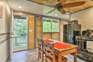 a kitchen with a wooden table and a refrigerator at Idyllic Pahoa Paradise Hike, Swim and Explore! in Pahoa