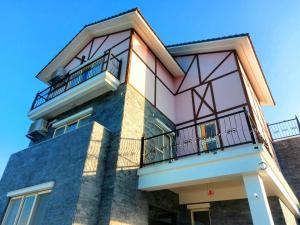 a building with balconies on the side of it at 旅居Villa in Dongshan