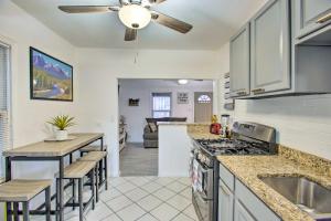 a kitchen with a stove and a counter top at Beautiful Denver Retreat about 4 Mi to Downtown! in Denver