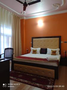 Katil atau katil-katil dalam bilik di Bakshi Home Stay