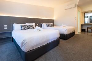 Postel nebo postele na pokoji v ubytování Fern Bay Motel