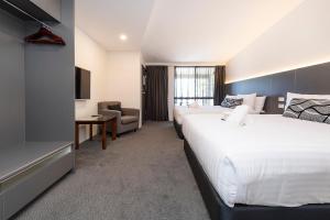 Postel nebo postele na pokoji v ubytování Fern Bay Motel