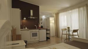a kitchen with a stove and a counter top at City Class Accommodation in Zadar
