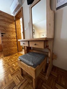 a dressing room with a vanity with a mirror at Guesthouse Smogavc in Zreče