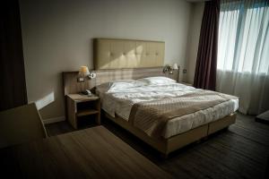 Łóżko lub łóżka w pokoju w obiekcie Hotel Delfino Venezia Mestre