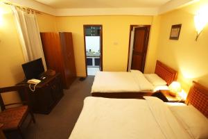 Letto o letti in una camera di Royal Astoria Hotel