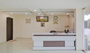 a salon with a counter in a room at Treebo Trend Amaya Inn Sector 72 in Noida