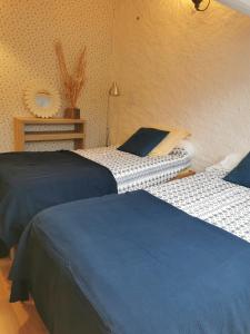 Ένα ή περισσότερα κρεβάτια σε δωμάτιο στο La maison de Céline