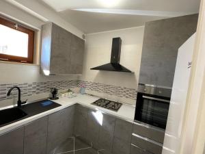 Kuchyň nebo kuchyňský kout v ubytování Residenza Punta Acquabella
