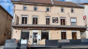 a building with a sign in front of it at Le YS Lounge Bar in Badonviller