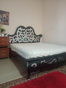 A bed or beds in a room at Furnished room just 1 minute to Al ain mall