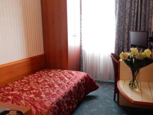 Postel nebo postele na pokoji v ubytování Hotel Brennero