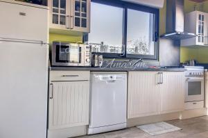 a kitchen with white appliances and a white refrigerator at AJ 09 - Villa "Le Hublot" in Ault