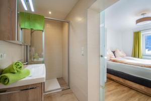 A bed or beds in a room at Cafe Max