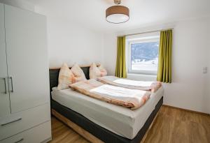 A bed or beds in a room at Cafe Max