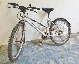 a bike parked next to a wall at Blue Palm Zanzibar in Bwejuu