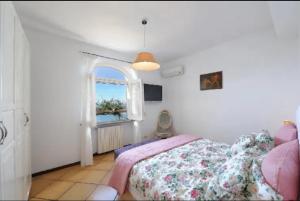 Ένα ή περισσότερα κρεβάτια σε δωμάτιο στο Villa Delle Ginestre - sea view