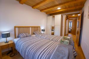 Postel nebo postele na pokoji v ubytování Casa Alameda 23 de Casas Das Figueiras en Ría Eo-Ribadeo