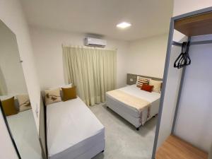 Un pat sau paturi într-o cameră la Fontes da Pipa by Liiv Rooms