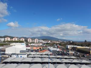 a view of a city with buildings and roofs at Azores Apartment in Ponta Delgada