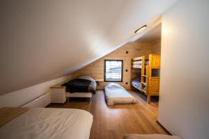 Postel nebo postele na pokoji v ubytování Chalet Le Loup Blanc