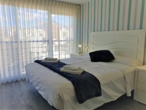 A bed or beds in a room at COBLANCA 3 by Apturist Még 15 kép