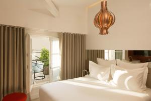 Postel nebo postele na pokoji v ubytování Hotel Dupond-Smith