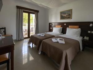 Postel nebo postele na pokoji v ubytování Irini Hotel