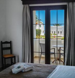 Postel nebo postele na pokoji v ubytování Irini Hotel
