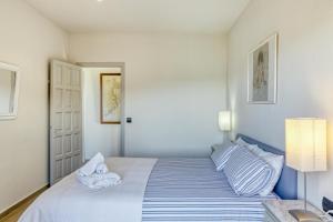 Posteľ alebo postele v izbe v ubytovaní Apartamento residencial 2º 2ª