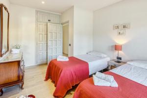 Posteľ alebo postele v izbe v ubytovaní Apartamento residencial 2º 2ª