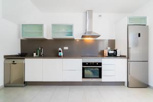 Kuchyň nebo kuchyňský kout v ubytování Apartamento Peonia + 17 fotografií