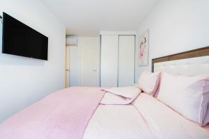 Postel nebo postele na pokoji v ubytování Apartamento Peonia