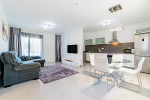 TV a/nebo společenská místnost v ubytování Apartamento Peonia